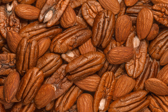 Pecan and almond nuts as background