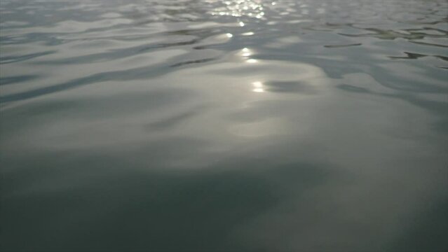 Slow motion smooth wavy water very hypnotising and calming early morning light