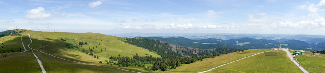 Fototapeta na wymiar Panoramic view from the Feldberg tower down into the valley. Feldberg is the highest mountain in the Black Forest. Germany