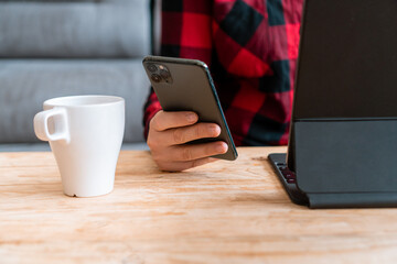 Person using smartphone at home