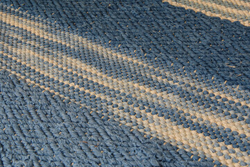 Closeup of rag rug in white and blue.