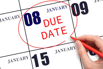 Hand writing text DUE DATE on calendar date January 8 and circling it. Payment due date