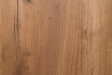 Fototapeta premium The wood texture with vertical lines of the cabinet lining is pale in color. Closeup