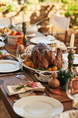 Thanksgiving, food and turkey table for gratitude, thanks and grace holiday lunch outside. Roast, vacation and festive outdoor dining meal with colorful decoration for USA celebration.