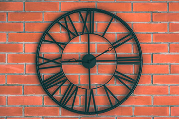clock on brick wall