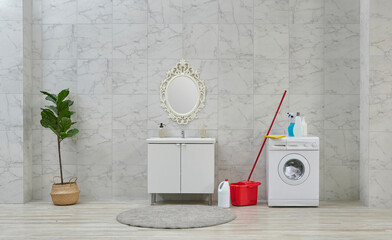 Cleaning kits in the bath room, white cabinet and sink, washing machine.
