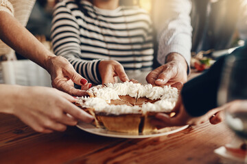 People, hands and pumpkin pie at a party for a thanksgiving celebration, event or gathering at home. Traditional dessert, cake or pie at a holiday dinner, lunch or meal in the dining room at a house.