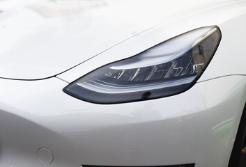 Headlight. LED headlamp of a modern car. Frontal lighting of highway vehicles with daytime running...