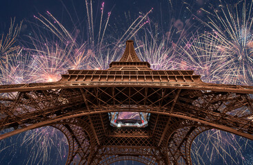 Eiffel tower with fireworks at night  in Paris, France. The Eiffel tower is the most visited...