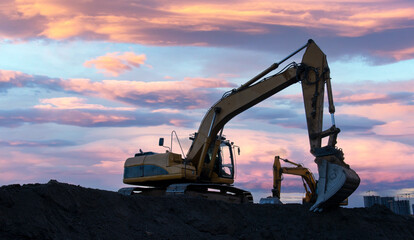 Excavator in open pit mining. Excavator on earthmoving on sunset. Loader on excavation. Earth-Moving Heavy Equipment. Earth mover ar construction site. Backhoe Loader on Road construction.