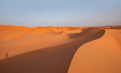 Fototapeta na wymiar Beautiful sand dunes in the Sahara desert with amazing sunset sky - Sahara, Morocco