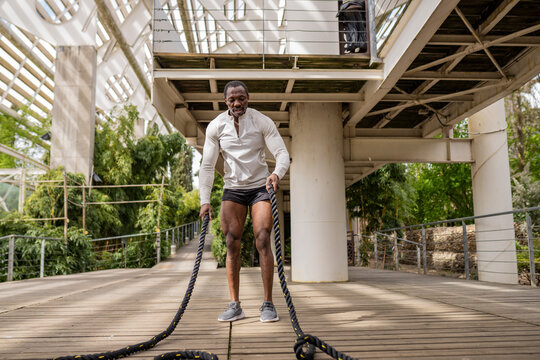 Senior african american man exercising with battle ropes