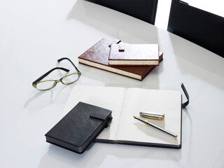 notebook and pen on office table