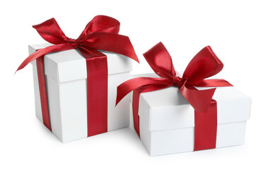Boxes with Christmas gifts on white background