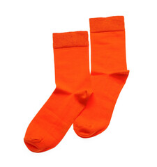Orange socks on white background, top view
