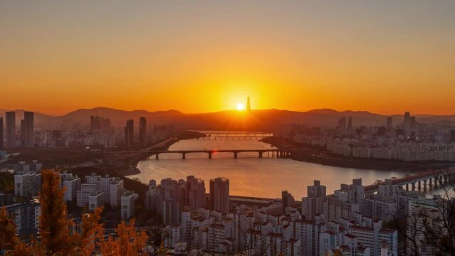 Time lapse Landscape of Seoul South Korea in the morning and the golden sun shines on the han river