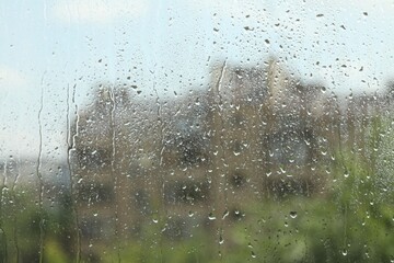 Window glass with raindrops as background, closeup