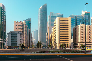 Abu Dhabi Streets and Skyscrapers. Tall Modern Glass Buildings in Abu Dhabi. United Arab Emirates.