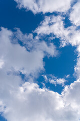 Dramatic blue sky with white clouds.