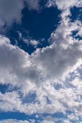 Dramatic blue sky with white clouds.