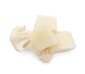Frozen cauliflower puree cubes and fresh cauliflower isolated on white, top view