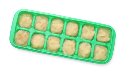 Apple puree in ice cube tray isolated on white, top view. Ready for freezing