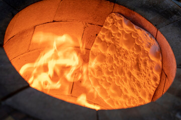 lavash bread cooked in a wood fire in a tandoor. Tandır lavas