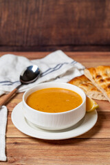 Lentil soup on wood floor. Turkish cuisine delicacies. local name ezo gelin corba