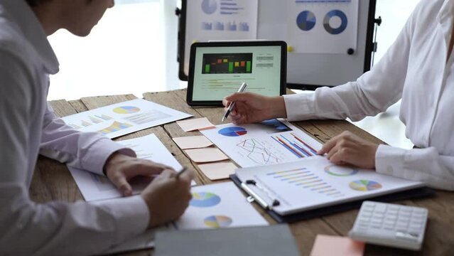 Brainstorm team, Marketers and financial accountants are discussing and analyzing charts to plan strategies to meet customer needs, Business data graph, Team meetings or business consulting.