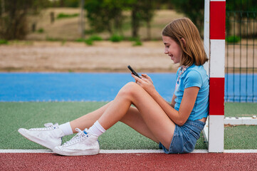 The girl who writes on a smart phone.