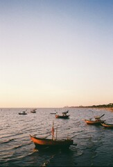 Naklejka premium boats at sunset