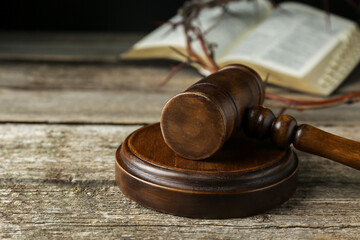 Judge gavel on old wooden table, closeup. Space for text