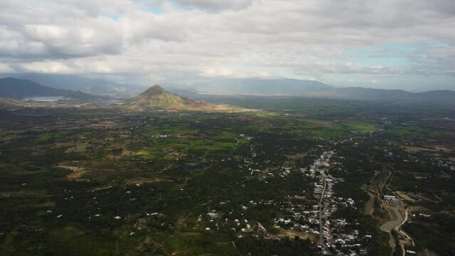 Aerial flying over surroundings of Cu Xa Da Nhim on partly cloudy day, Vietnam