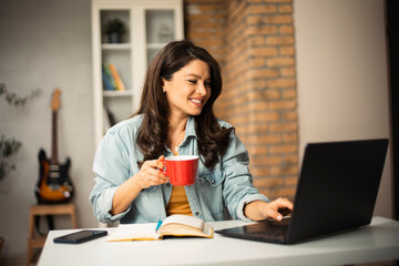 Pregnant woman in office. Beautiful businesswoman enjoy in fresh coffee.
