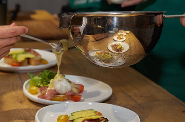 The process of cooking: laying out the finished dish on plates