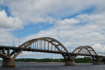 City bridge across the river with metal arches
