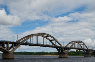 City bridge across the river with metal arches