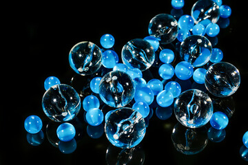 blue beads balls on black mirror background