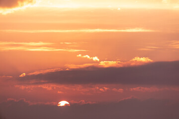 Colorful clouds at sunset as background.