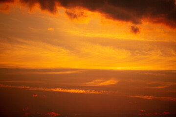 Colorful clouds at sunset as background.