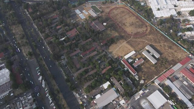 Aerial View Of Sports Track And Field Belonging To CCH Vallejo UNAM In Mexico City. Dolly Forward