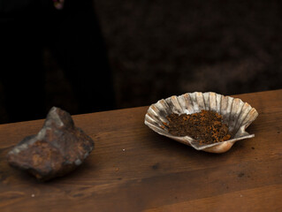 Mixing ready to start a fire using flint