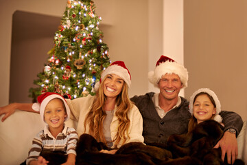 Christmas, holiday and family, portrait with love and happy together to celebrate at home, parents with children and smile. Mother, father and kids with happy family and Christmas tree decoration.