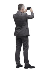 Businessman taking pictures with his smartphone PNG file no background - obrazy, fototapety, plakaty