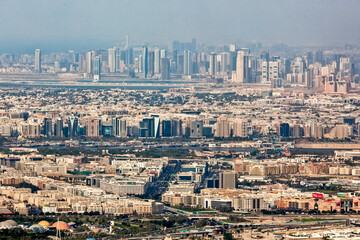 Fototapeta premium Panoramic top view of Dubai in UAE. Modern arab city architecture