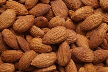 Delicious raw ripe almonds as background, closeup