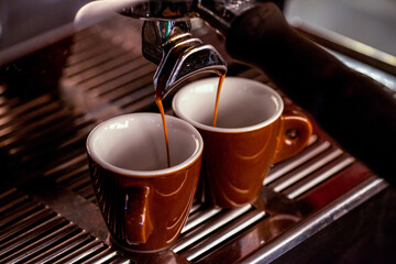 Modern coffee machine with a cup in restaurant