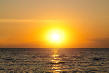 Sea sunset sky. Ocean sunrise. Sunset sky and sun through the clouds over. Meditation ocean and sky background. Tranquil seascape. horizon over the water.
