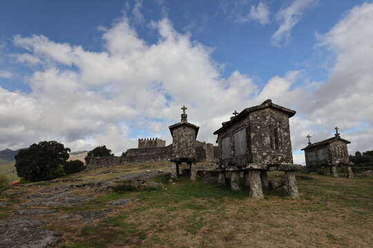 An old Granary (espigueiros) and castle above the village of Lindoso in the Parque Nacional da Peneda-Geres in northern Portugal.