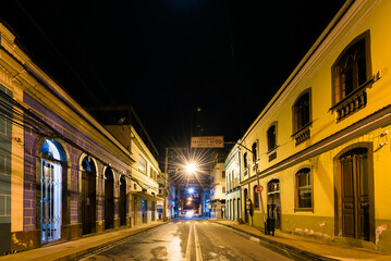 Empty streets with historical buildings of a colonial town in Espirito Santo state at Night, in Brazil